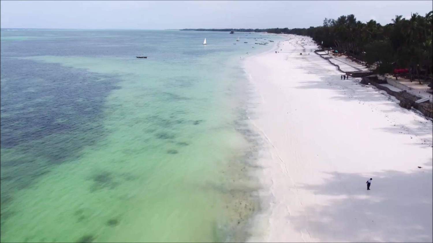 Aerial of the 582 m white-sand beach and turquoise reef