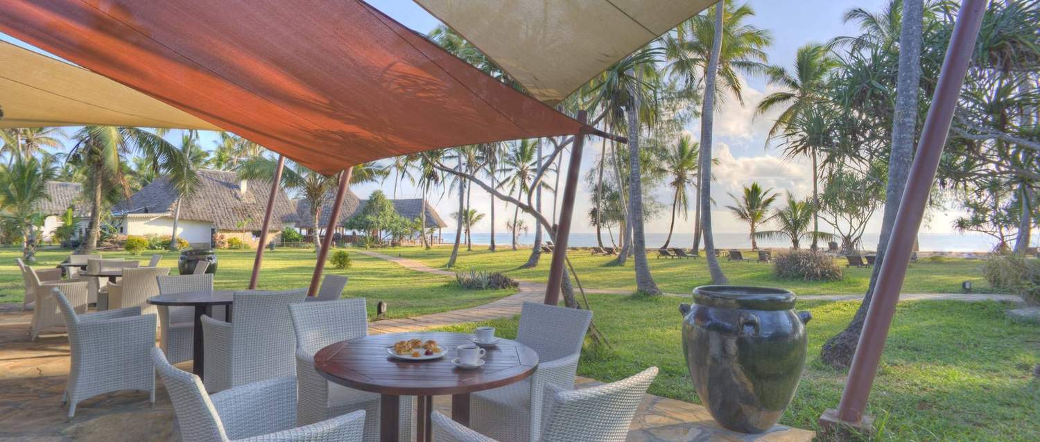 Sun loungers and palms on Bluebay's 582 m white-sand beach